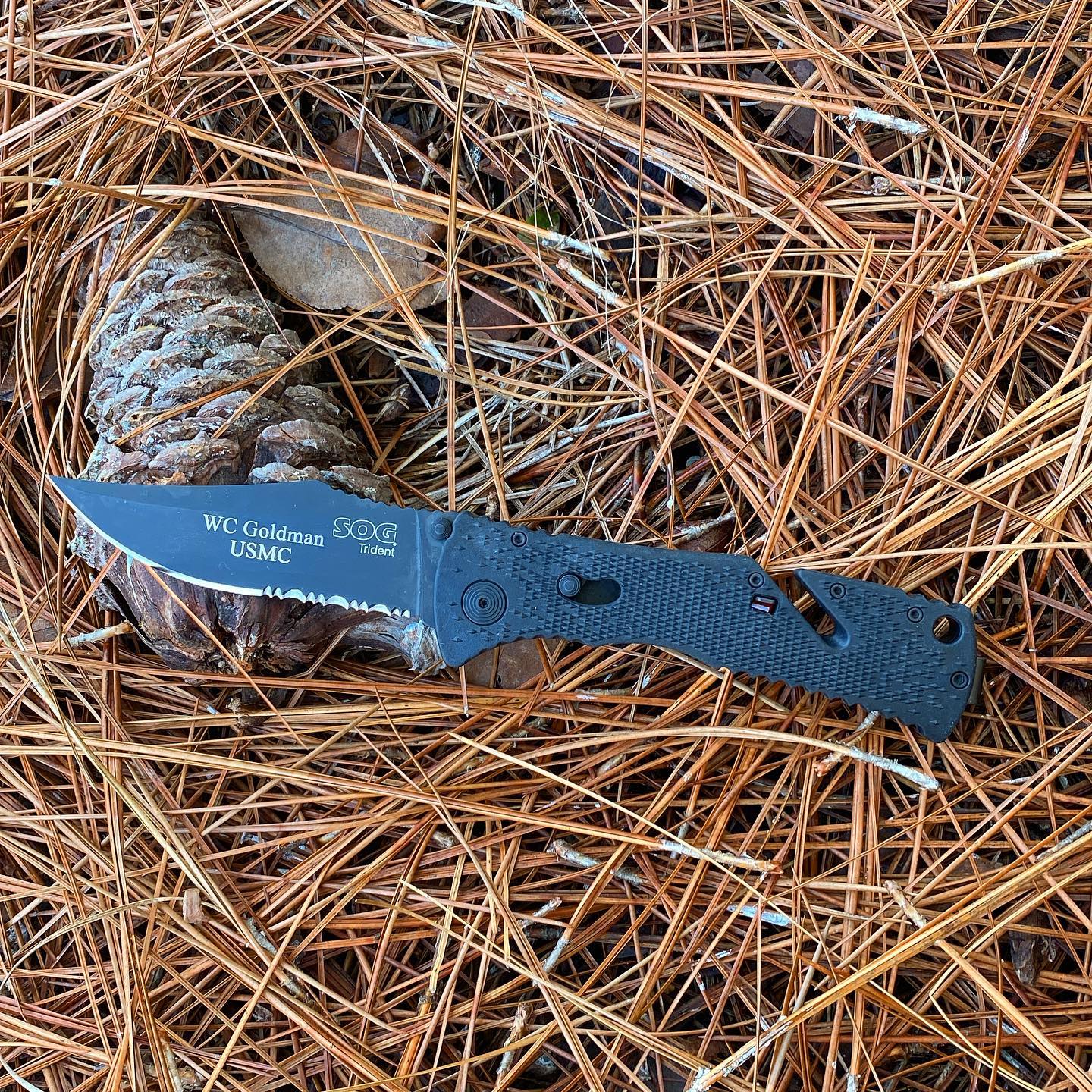 SOG Trident knife TF-1 has a locking blade mechanism and a line cutter in the handle. Just engraved for our customer and we thank him for his service. #tridentknives #TF-1 #linecutter #onehandopening